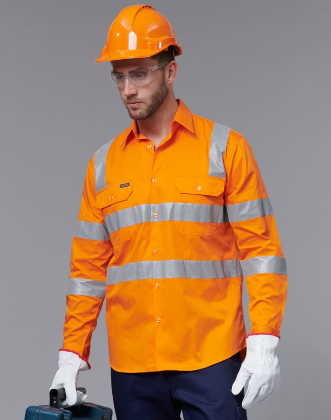 A safety shirt in bright orange with reflective stripes, worn by a model donning protective gear and gloves.
