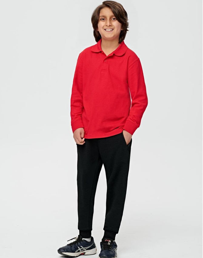A boy wearing a red long-sleeve polo and black poly/cotton terry sweat pants, standing against a plain background.
