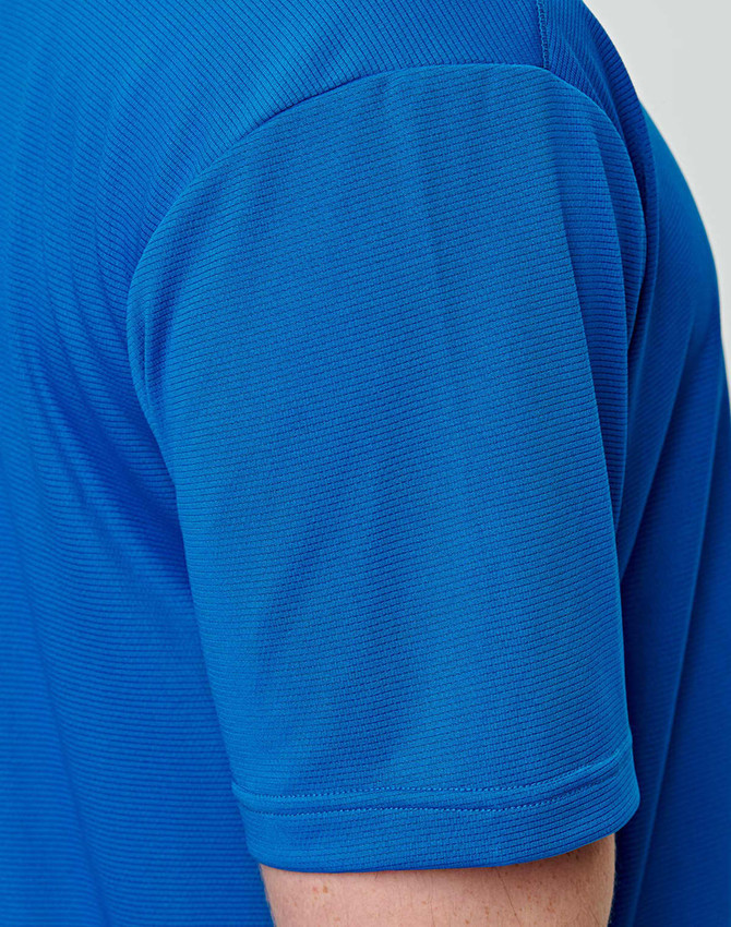 A close-up of a men's short-sleeve T-shirt in vibrant blue, featuring a subtle textured pattern.