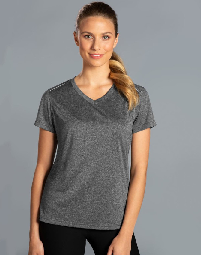 A grey short sleeve tee with a V-neck design, featuring a logo, worn by a smiling woman against a plain background.