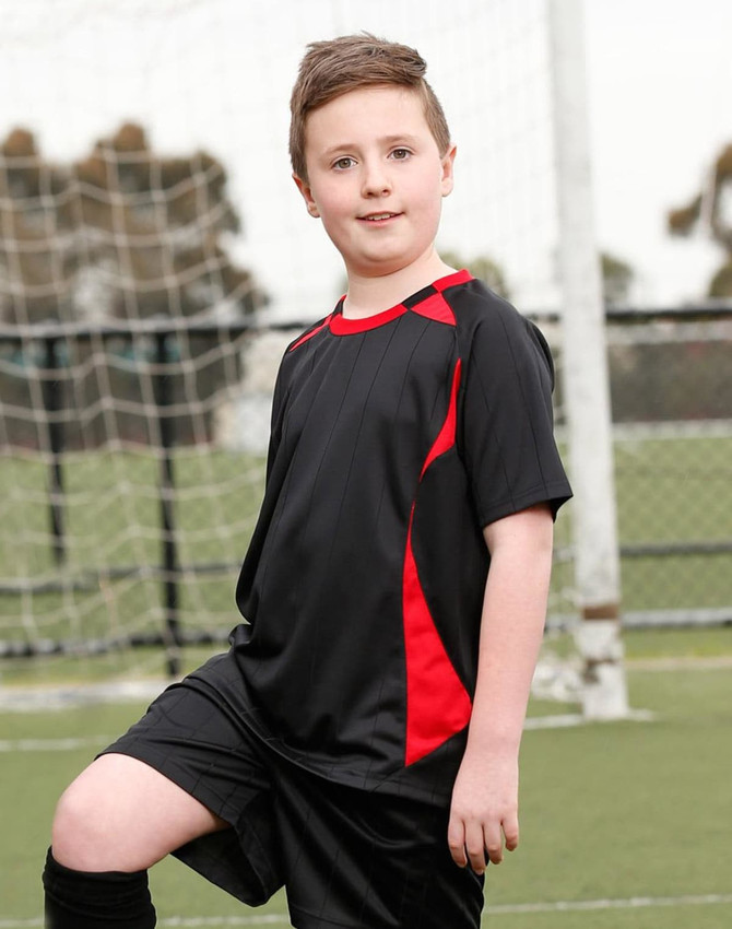 A kid's soccer jersey featuring black with red accents, designed for sports uniforms. It includes a logo.