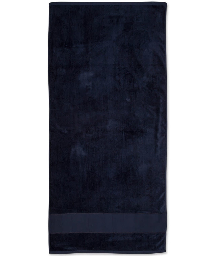 A dark navy terry velour beach towel measuring 75x150 cm, featuring a simple design and a branded logo.