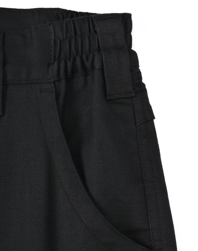A close-up of unisex cotton stretch ripstop work pants in black, featuring a textured waistband and side pockets.