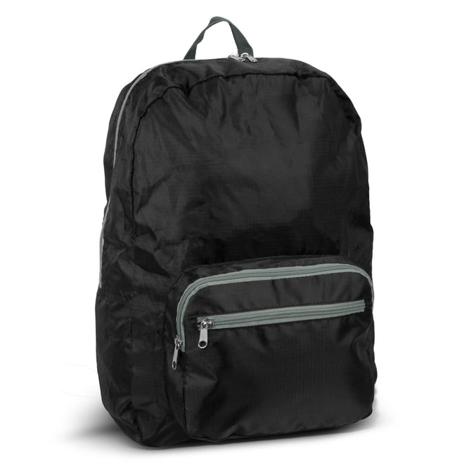 A foldable backpack in black with a green zippered front pocket, featuring a carrying handle on top.