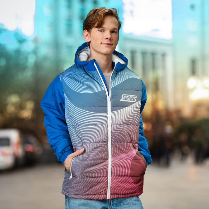 A custom puffer jacket in blue and red with a wavy pattern and a logo on the front, worn by a model outdoors.