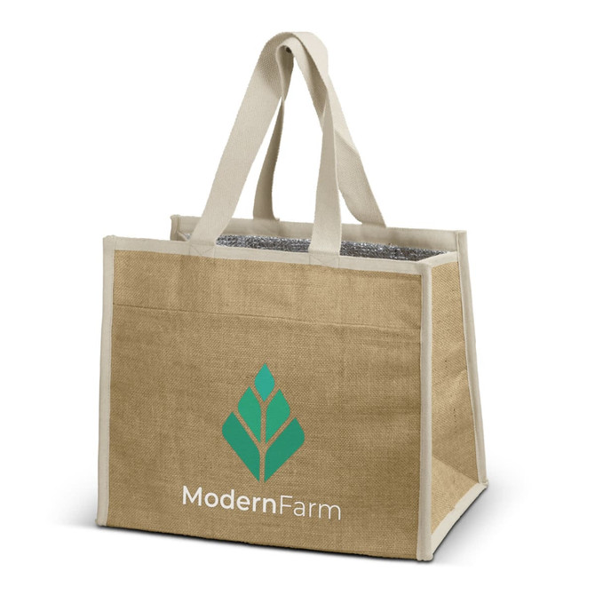 A jute cooler bag in natural beige with sturdy handles and a logo on one side. The interior is insulated.
