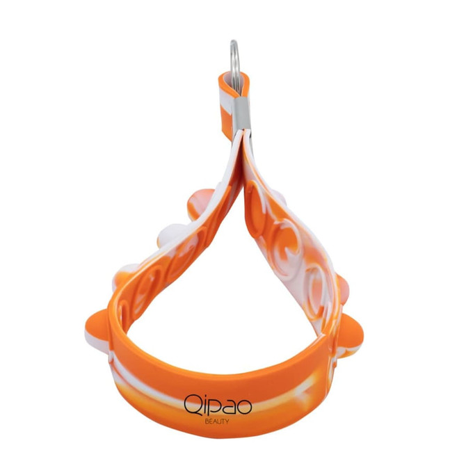 An orange and white silicone keychain featuring popper elements, with a metal keyring attachment.