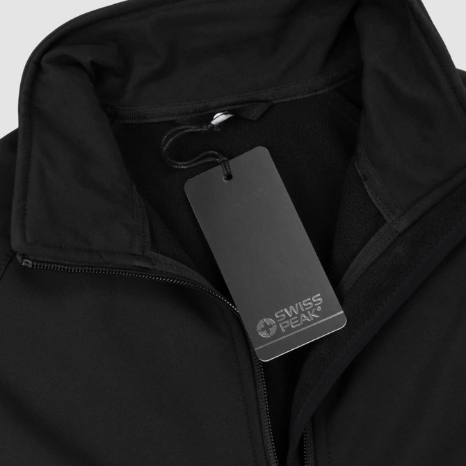 A black softshell jacket with a zip closure and a tag featuring a logo.