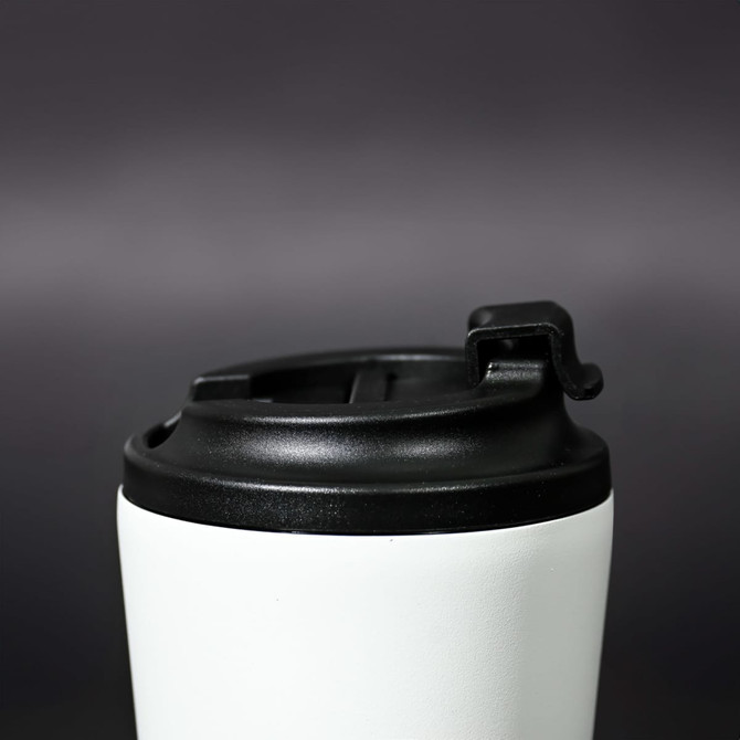 A travel mug featuring a white body and a black lid, with a logo visible on the surface.