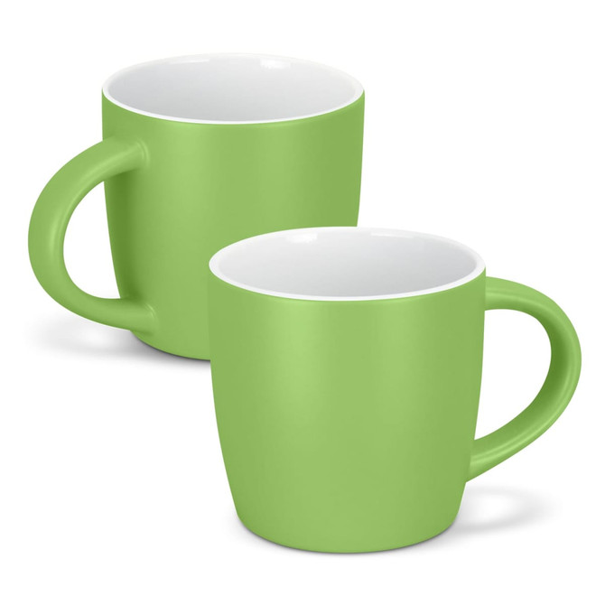 A drinkware set featuring two green coffee mugs with smooth finishes and sturdy handles. Each mug has a white interior.
