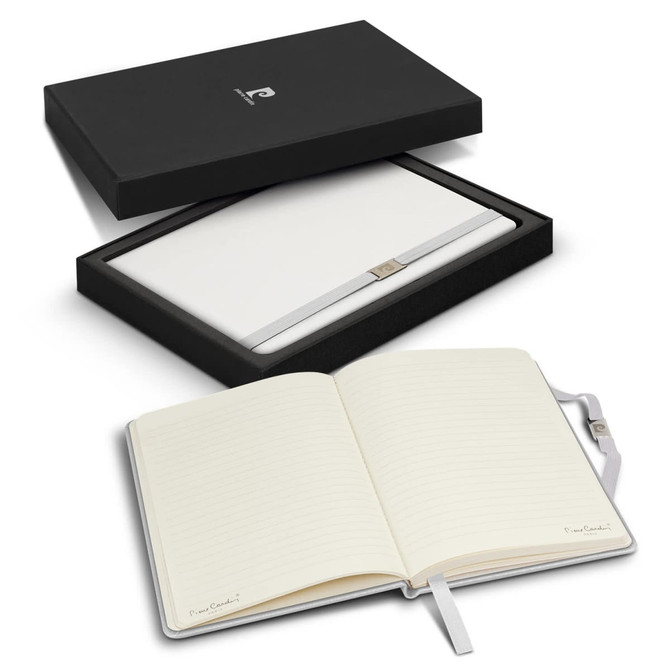 A notebook gift set featuring a white notebook with lined pages, presented in a black box with a logo.