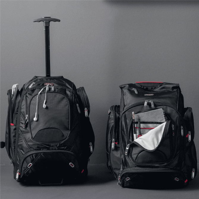 A black wheeled backpack with a retractable handle, featuring multiple compartments and zippers.