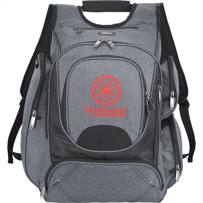 A grey backpack with multiple zippered compartments and a logo on the front. Designed to hold a laptop and other essentials.