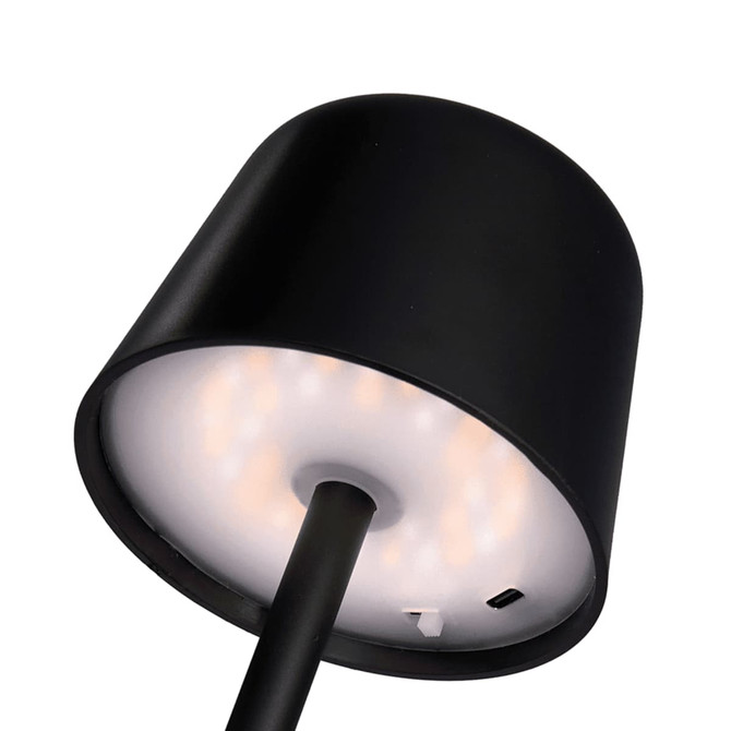 A black mini rechargeable lamp featuring a cylindrical shade and a circular light base, with a charging port visible.