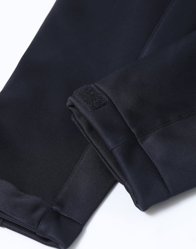 A close-up of the cuffs of a black ladies' sustainable softshell corporate jacket with a velcro detail.