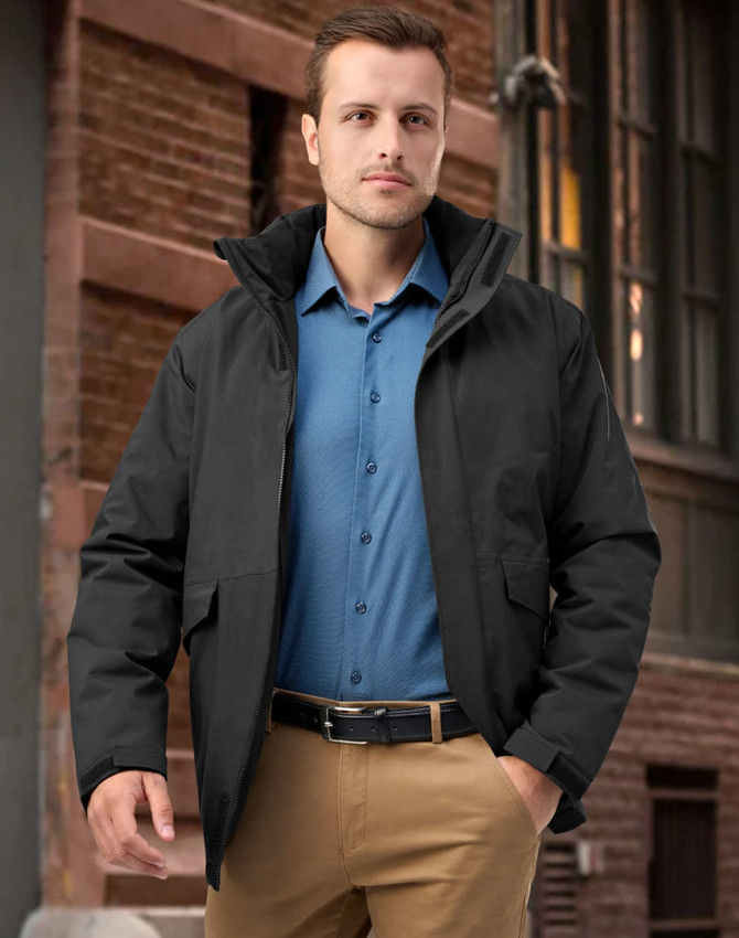 A unisex quilted waterproof jacket in black, featuring a hood and front pockets, worn by a model outdoors.