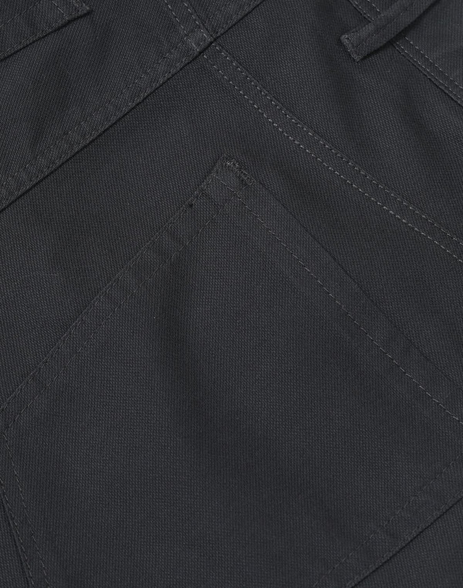 A close-up of ladies' flexi chino pants in dark grey, featuring detailed stitching and a pocket design.
