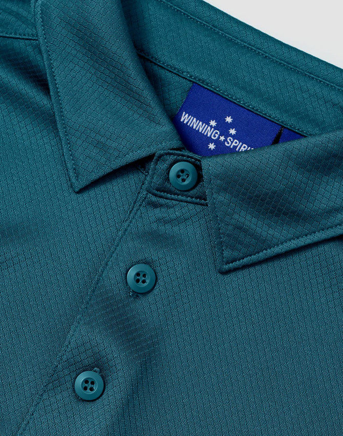 A teal sustainable jacquard knit short sleeve polo featuring a collar and button detail, with a logo on the inside.