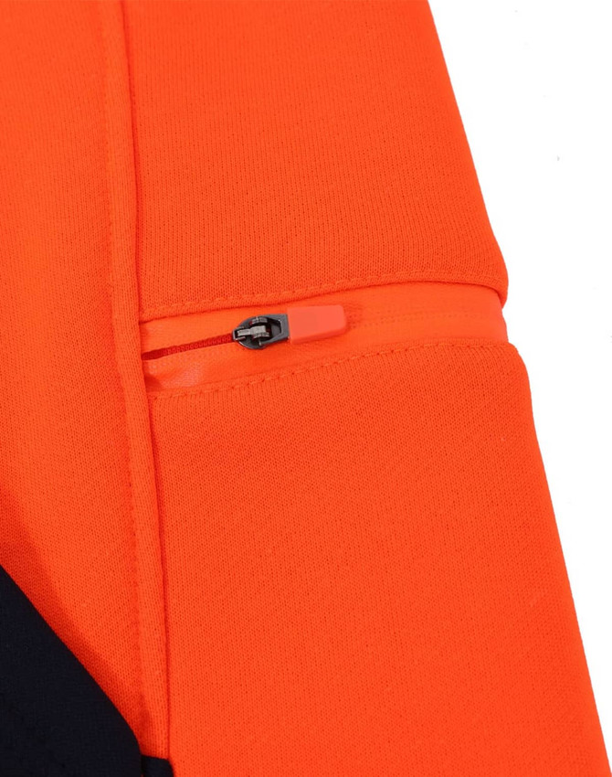 A close-up of an orange and navy fleece hoodie featuring a zipper pocket on the sleeve and a logo.
