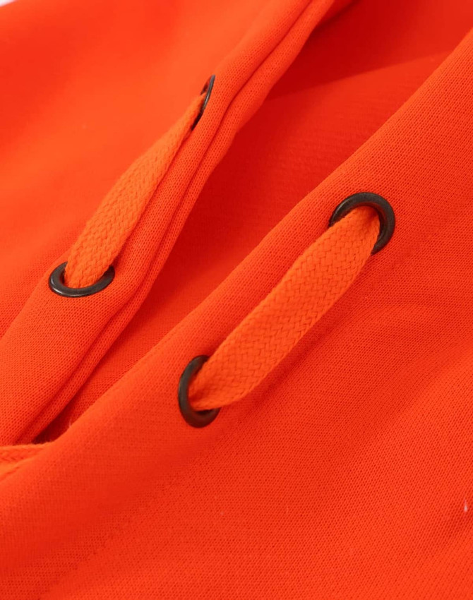 A close-up of an orange fleece hoodie with black eyelets and drawstrings. The fabric appears water resistant.