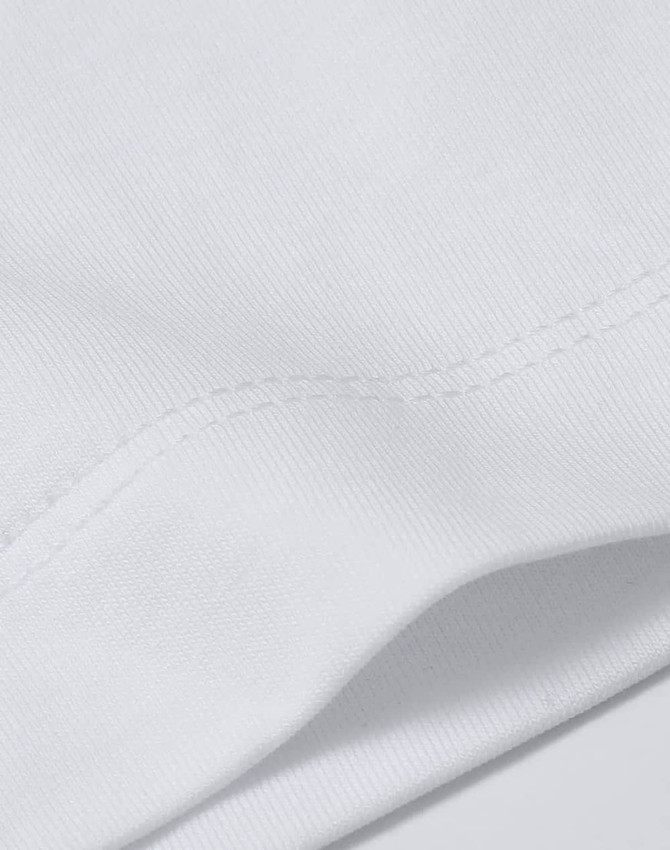 A close-up view of a white cotton t-shirt, showcasing its fabric texture and stitching details.