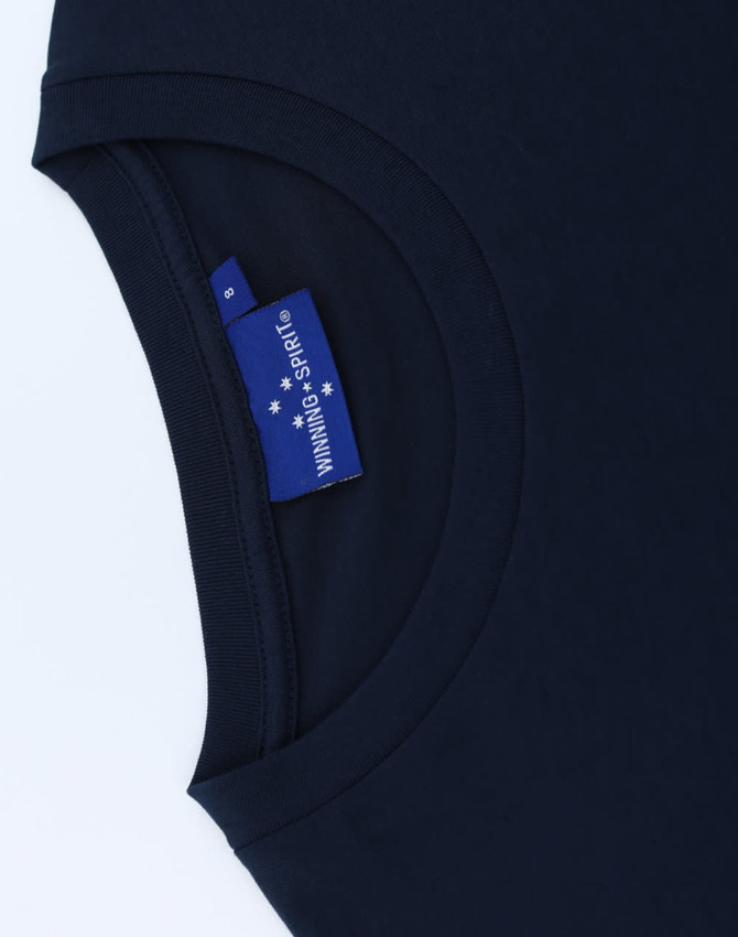 A navy blue premium cotton short sleeve tee shirt featuring a tag with branding.