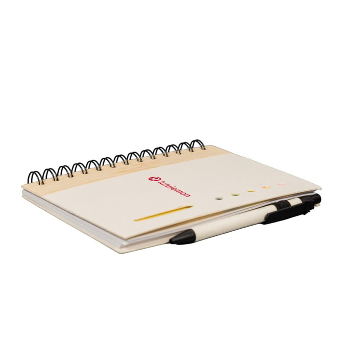 A spiral-bound notebook with a white cover, featuring a pen and a logo. The pages are blank with a yellow accent.