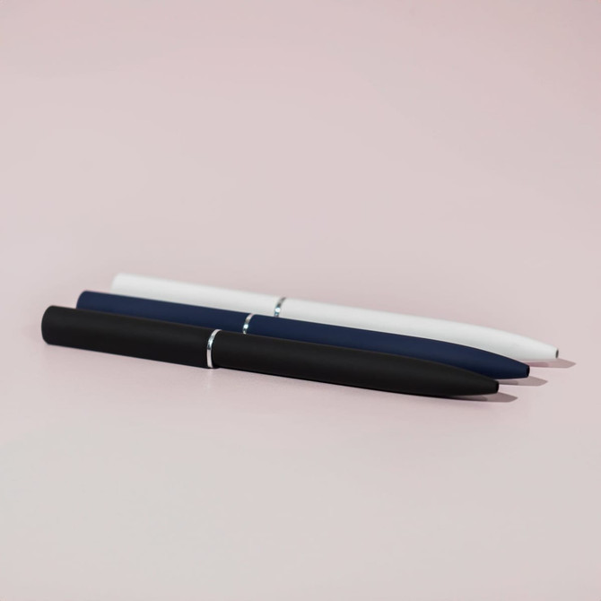 A set of three ballpoint pens in white, navy blue, and black with a mirror finish and a logo.