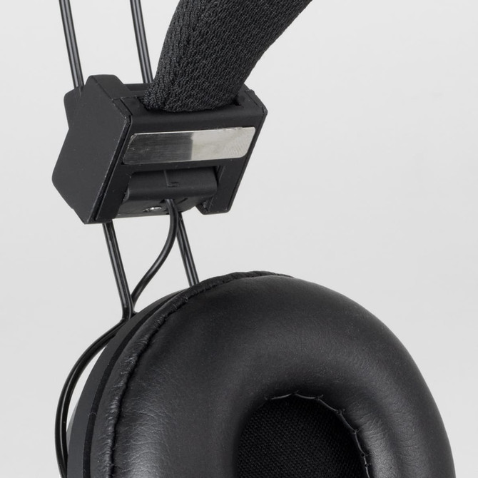 A close-up of black Opus Bluetooth headphones, featuring a padded ear cup and adjustable headband with a logo.