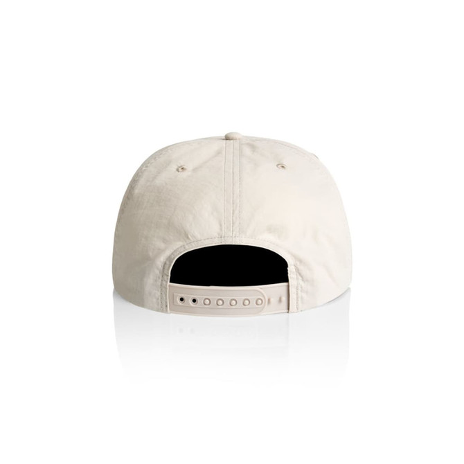 A cream-coloured cap with a flat brim and adjustable strap at the back, featuring a logo.