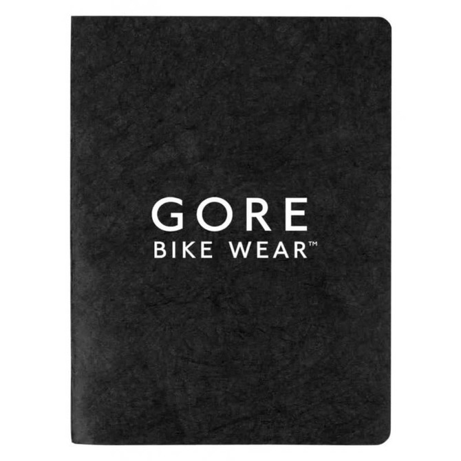 A black notebook with blank pages and a logo on the front cover.