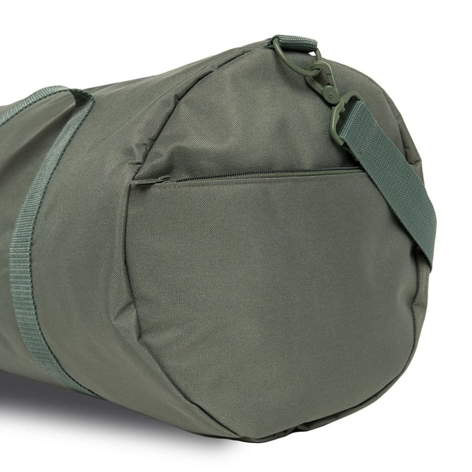 A green duffel bag featuring a sturdy strap and a zippered pocket on the side.