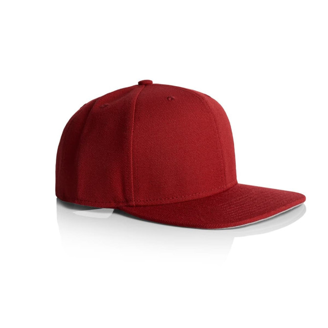 A red cap with a flat brim and structured design, featuring a logo on the front.