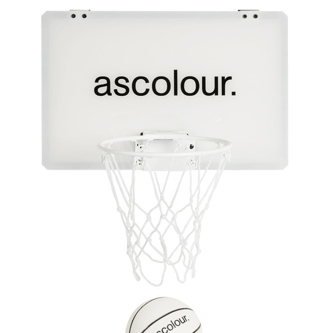 A mini basketball hoop set featuring a white backboard and a basketball with a logo.