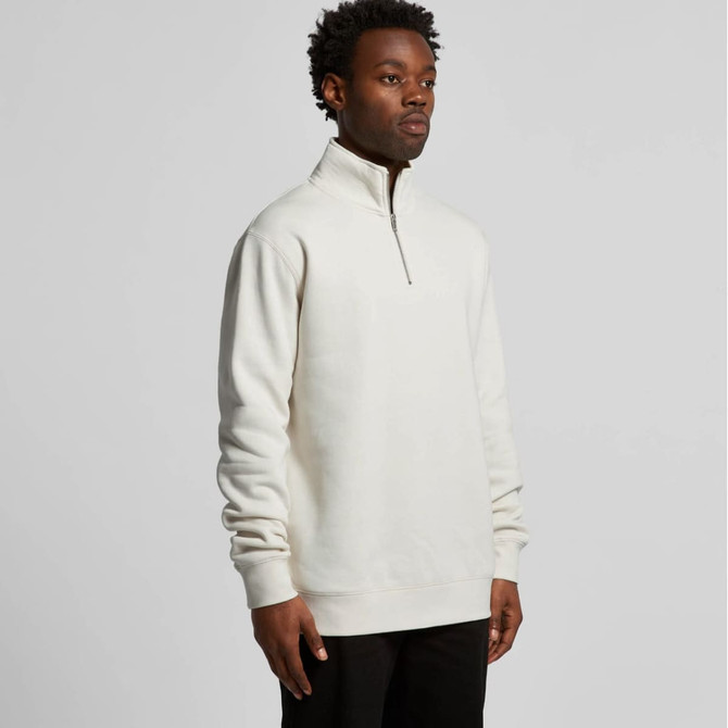 A cream-coloured half zip crew jumper designed for comfort, featuring a stand-up collar and long sleeves.