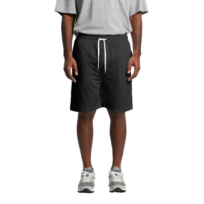 Black sports shorts with an elastic waistband and drawstring, modelled by a person wearing a grey t-shirt and shoes.