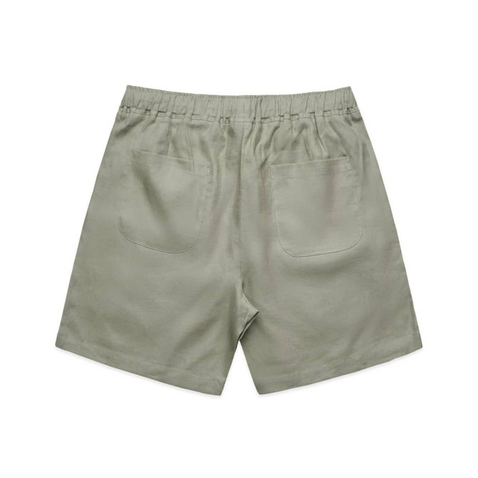 Linen shorts in a soft green hue, featuring a relaxed fit and two back pockets.
