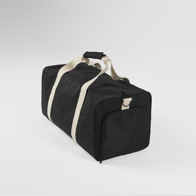 A black duffle bag with beige straps and a zippered compartment, featuring a plain design and branding.