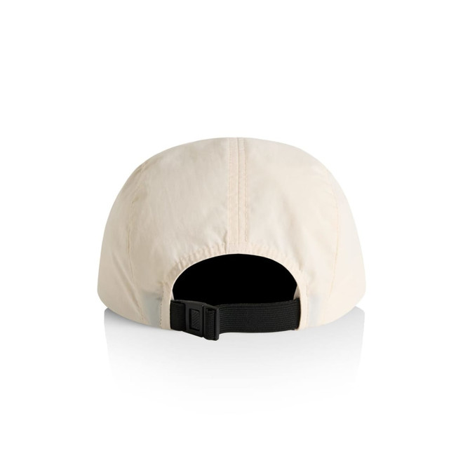 A cream-coloured nylon cap featuring a black adjustable strap and a logo on the back.