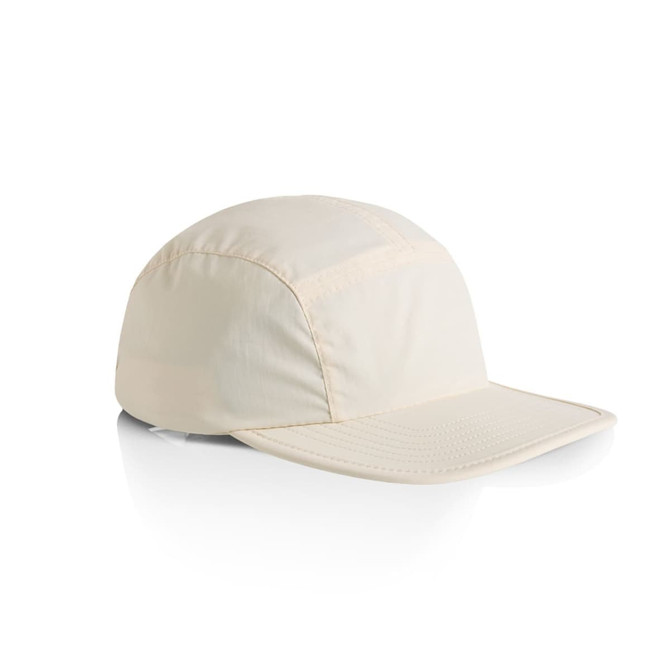 A light cream nylon cap with a structured design and a flexible brim. It features a logo on the side.