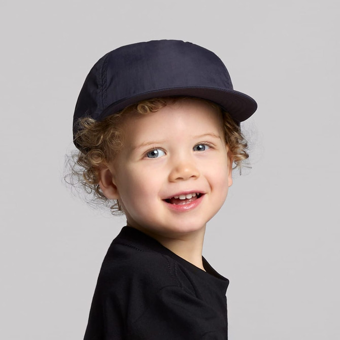 A navy cap designed for kids, featuring a structured brim and an adjustable fit.