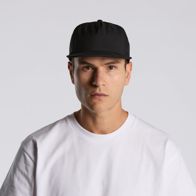 A black cap is worn by a model in a white shirt, featuring a logo on the front.