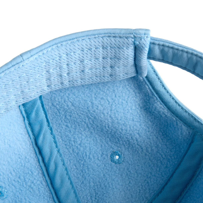 A light blue cap featuring a soft interior lining and visible stitching details. The cap has a logo inside.