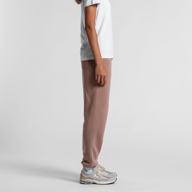 Track pants in a soft brown hue, featured alongside a plain white t-shirt and grey sneakers. 
