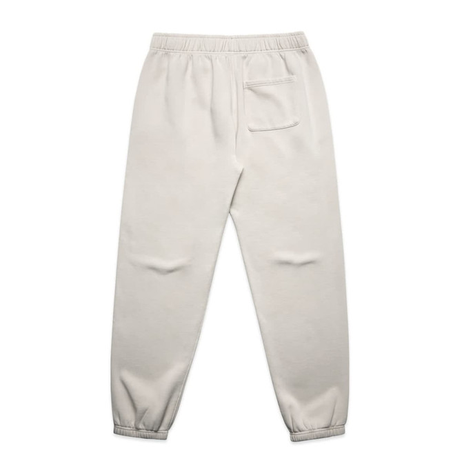 Faded cream track pants with a relaxed fit, featuring an elastic waistband and a back pocket.