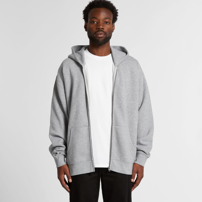 A grey zip-up hoodie features a spacious fit with a hood and a front zip, worn over a white t-shirt.