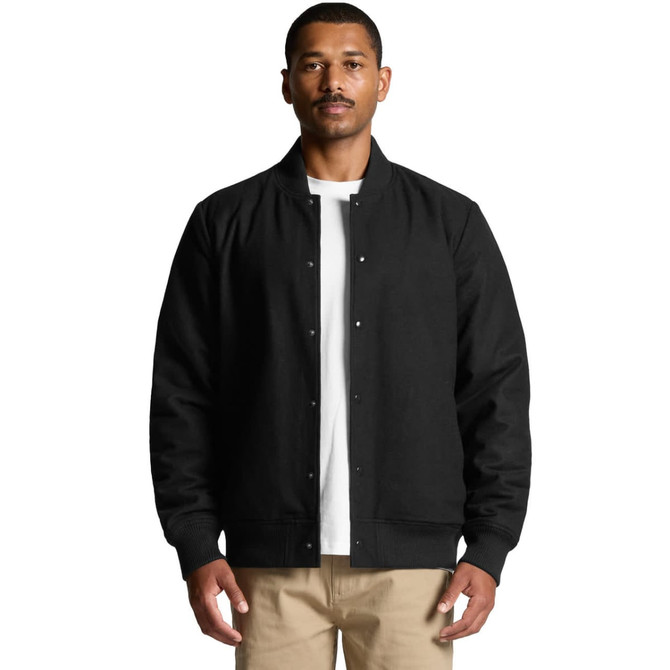 A black felt bomber jacket is worn by a man, featuring a button-up front and ribbed cuffs. It has a logo on the front.