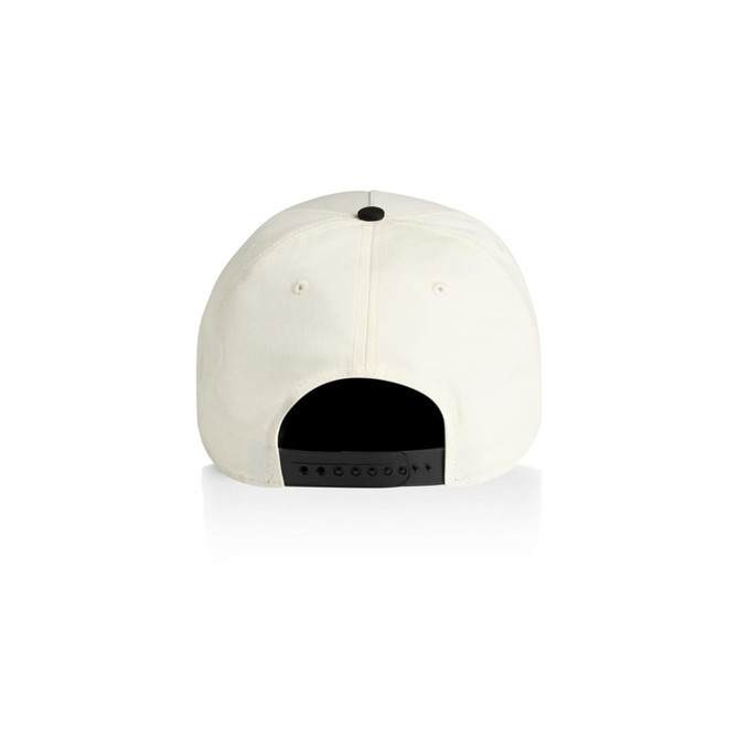 A two-tone cap featuring a cream front and a black back, with an adjustable strap and a logo on the back.