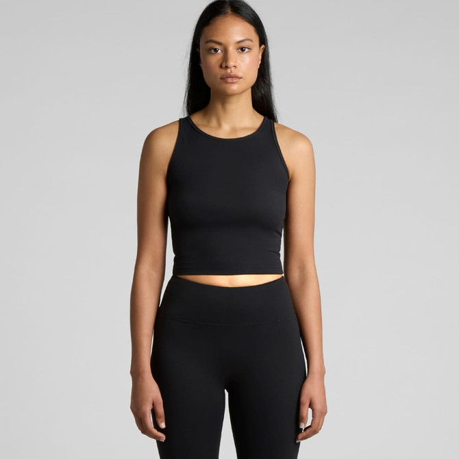 A black active crop tank top displayed on a model, featuring a form-fitting design and a subtle logo.