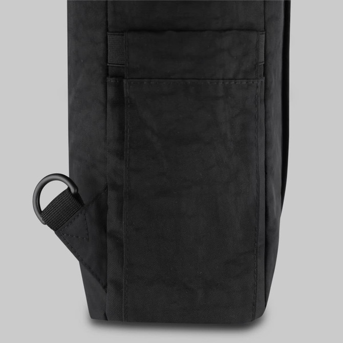A black tasman toting pack with a side pocket and a metal loop for attachment.